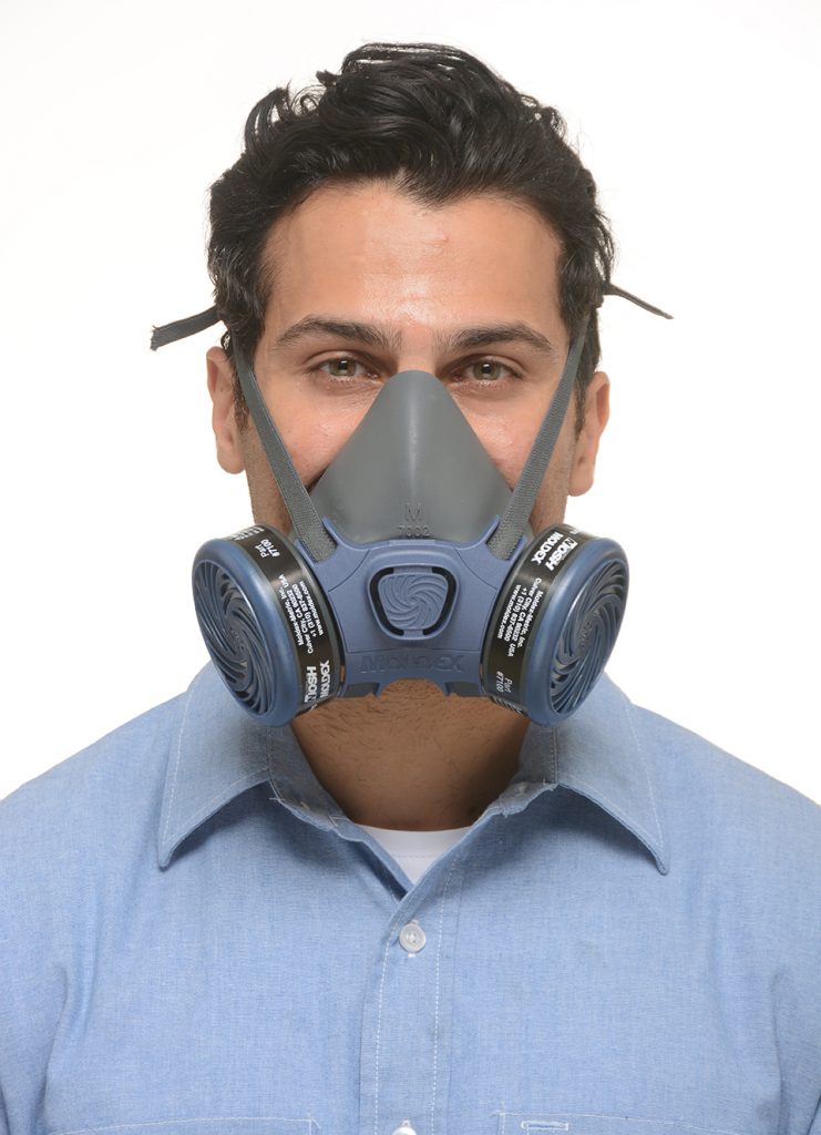 view from the front of a man wearing reusable half-face respirator mask